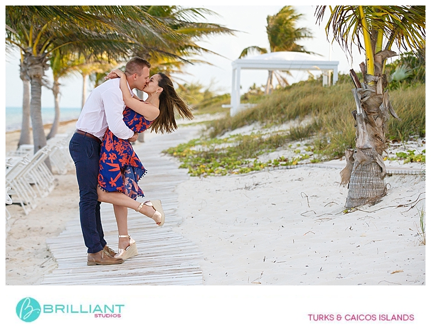 couple kissing at the beach in providenciales 