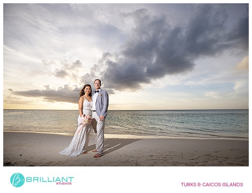 bride and groom at sunset in grace bay 