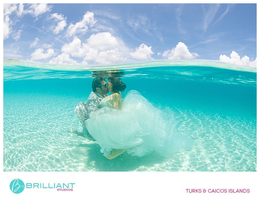 bride and groom kissing underwater trash the dress