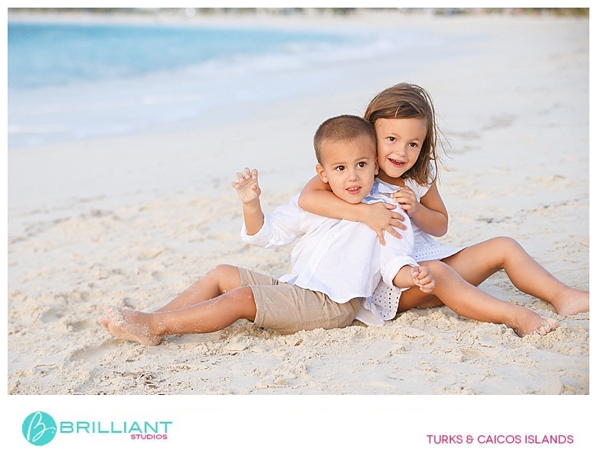 brother and sister on grace bay beach with a turks and caicos photographer 