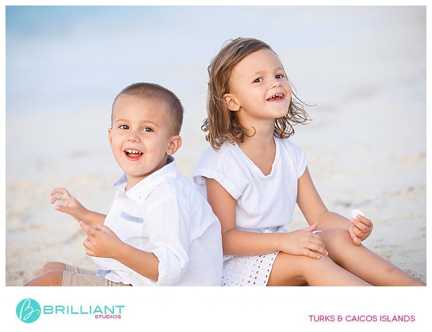 kids having fun on grace bay beach with family photographer turks and caicos 